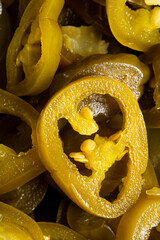 The texture of chopped jalapeno peppers as a background. A close shot of chopped Mexican jalapeno...