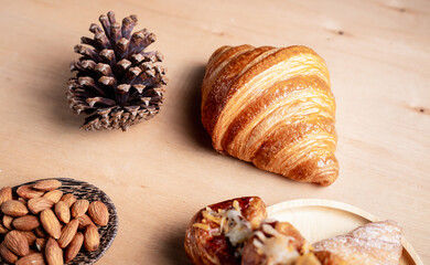 Topview shot of almonds with big slices of bread on dark wooden background concept of health care
