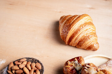 Topview shot of almonds with big slices of bread on dark wooden background concept of health care
