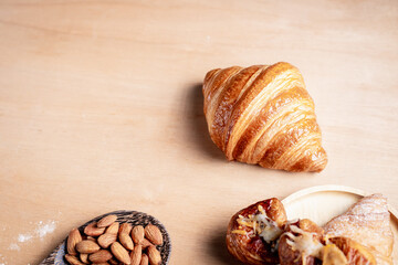 Topview shot of almonds with big slices of bread on dark wooden background concept of health care
