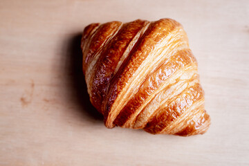 bread and croissants Aromatic almonds laying on wooden floor with an empty floor in a vintage tone style
