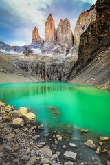 Torres Del Paine granites at sunrise and lake reflection, Chilean Patagonia