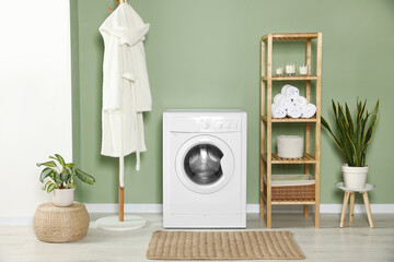 Stylish laundry room with washing machine. Interior design