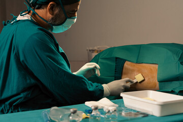 Doctor or surgeon apply betadine to the patient for anesthesia injection to reduce pain before...