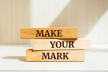 Wooden blocks with words 'Make Your Mark'.