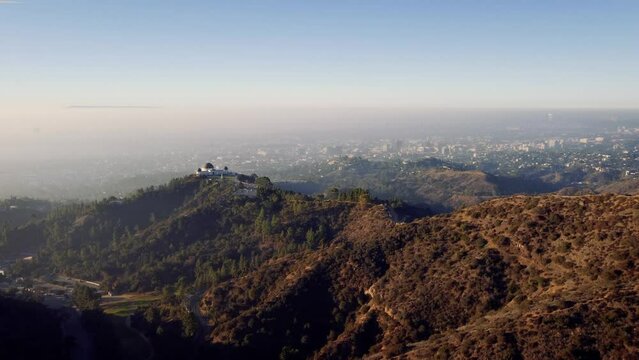Misty morning over los Angeles along with Griffith observatory with the Westside skyline of the city in the background