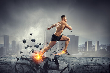 Male runner against dark background