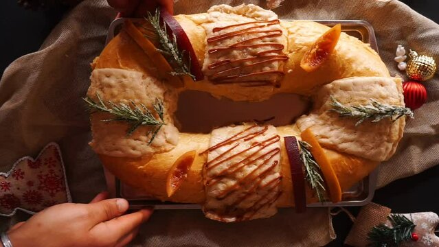 Top view of a rosca de reyes placed on the table. Horizontal video.