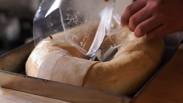 Horizontal video of the preparation of a traditional Mexican bread. Rosca de reyes.