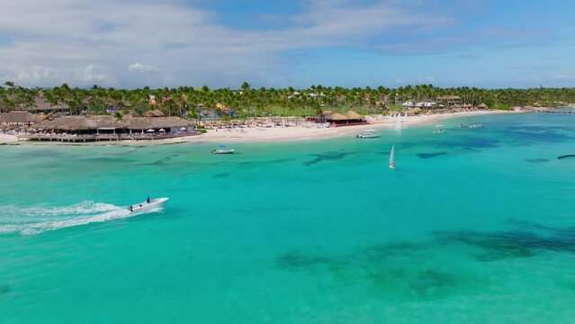 Boat cruise along Caribbean coastline - sandy beach, palms, turquoise sea, Playa Blanca in Punta Cana