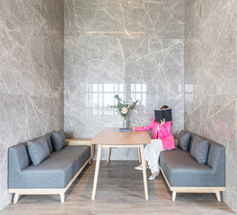 business woman reading a book near wall, space for text