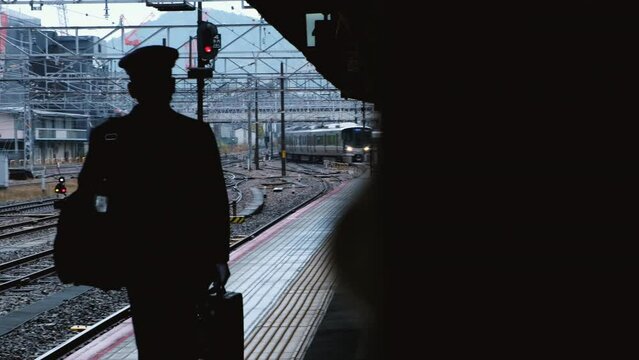 Train conductor are walking on Platform in train station platform in Tokyo. 