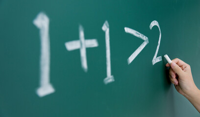 One plus one more than two written