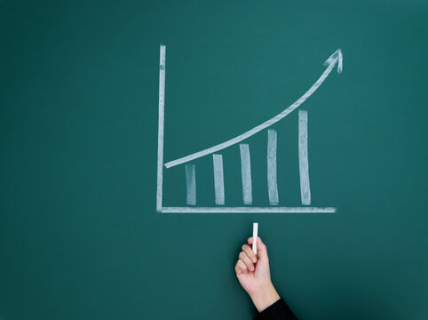 White chalk draw increment chart on blackboard