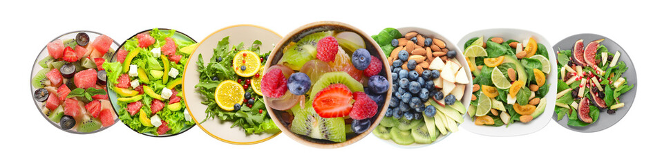 Group of healthy salads on plates against white background