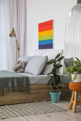 Interior of modern bedroom with rainbow painting