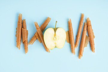 Tasty apple pastilles on color background