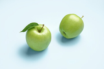 Ripe green apples on color background