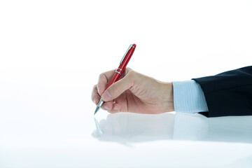 Businessman hand holding a pen isolated on white background