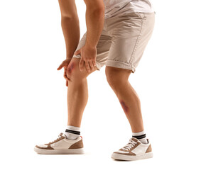 Man with bruises on legs against white background
