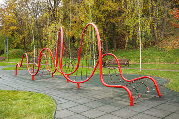 View of red climbing net on children's playground