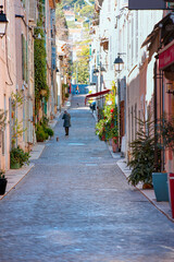 Fototapeta na wymiar Long narrow street in city center -Cassis, France