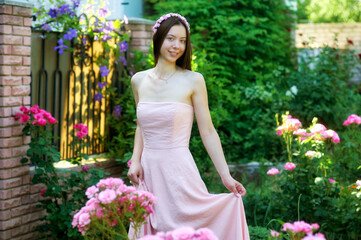 Young woman in pink dress outdoors