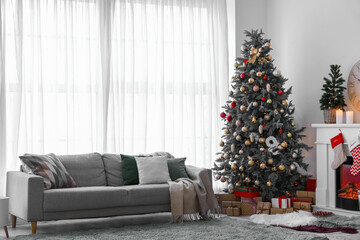 Interior of living room with sofa and Christmas trees
