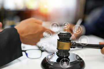 judge on wooden table And experienced lawyers meet with clients and give advice behind the scenes. legal services legal consulting concept