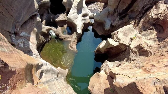 Bourke's Luck Potholes huge cylindrical pits in the sandstone bedrock seen from above.