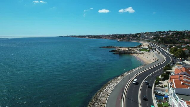Aerial view paralell to coast Caxias and the Fort of Sao Bruno, in sunny Portugal