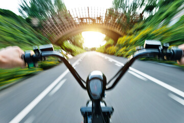 Riding on high speed electric bicycle in park
