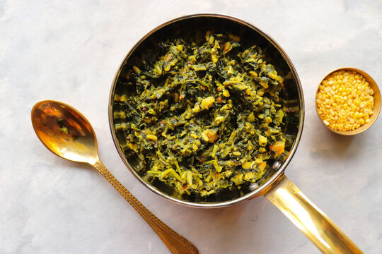 Palak and Moong dal sabzi. also known as spinach and lentil curry. Healthy green leafy vegetables Saag. Copy space. 