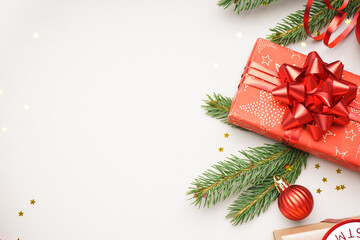 Gift box with Christmas branches on white background, closeup