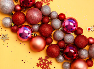 Beautiful composition with Christmas decorations and sequins on color background