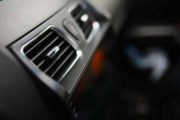 The process of choosing climate control in the car. Various controls in auto switches. Modern car interior