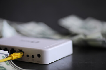 internet router and one hundred dollars. Communication and internet cost concept