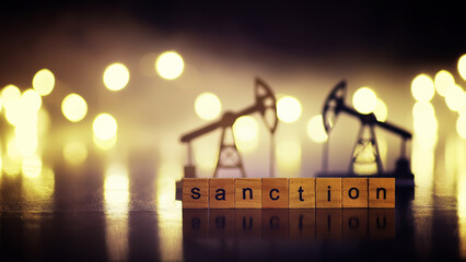 word sanctions spelled in letters on table made of wooden block letters with dramatic lighting and...