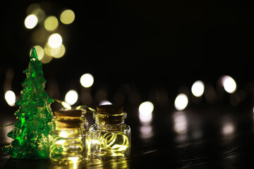 Decorated christmas tree pine on blurred gold background bokeh light banner.