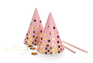 Pink party hats with glitter and straws on white background