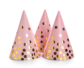 Pink party hats with glitter on white background