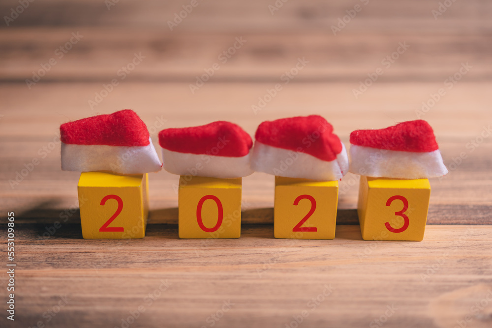 Aufkleber row of wood cube block with text 2023 for happy new year concept