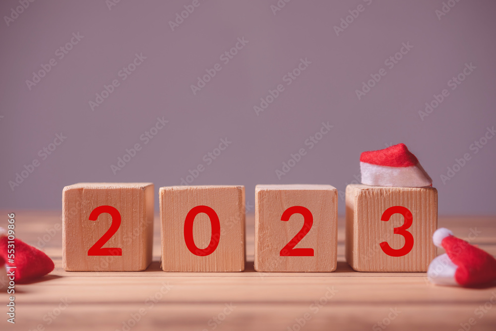 Aufkleber row of wood cube block with text 2023 for happy new year concept
