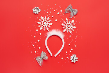 Beautiful Christmas headband and decorations on red background