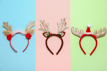 Set of funny Christmas headbands on color background