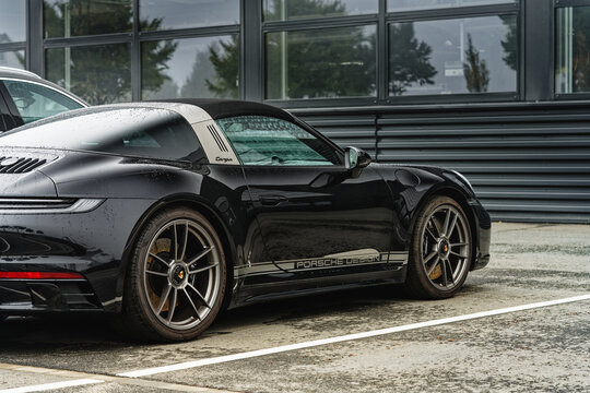 Dortmund, Germany - 09 11 2022 rear side view of black Porsche targa parked with some water drops after rain.
