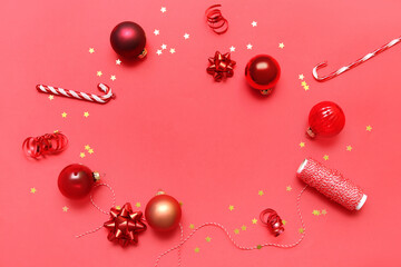 Frame made of beautiful Christmas decorations and rope on red background