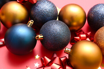 Heap of beautiful Christmas decorations on red background, closeup