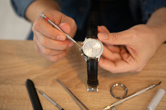 close up of craftsman repairing a watch