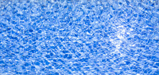 Abstract background with Hotel swimming pool with sunny reflections.